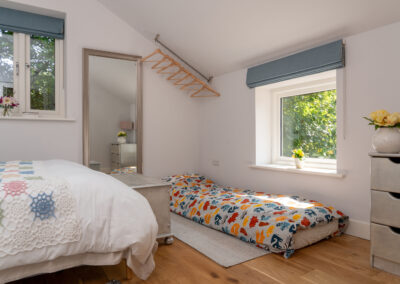 Bedroom with spare bed made up for child